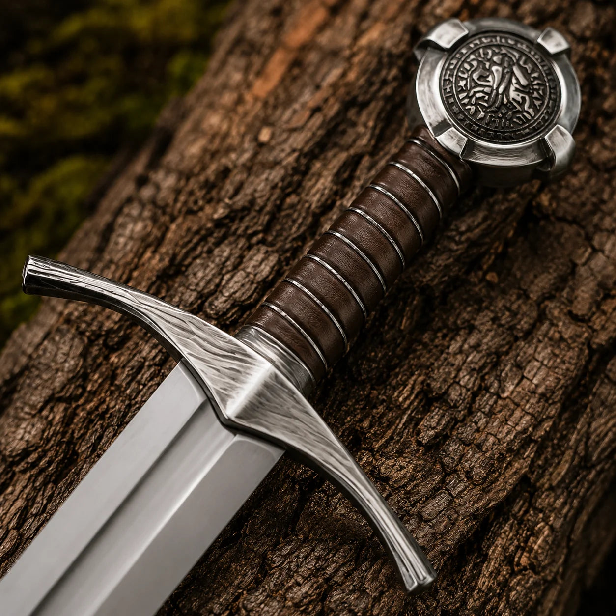 Close-up of the Accolade Knights Templar Sword handle, silver crossguard, brown grip and detailed round pommel