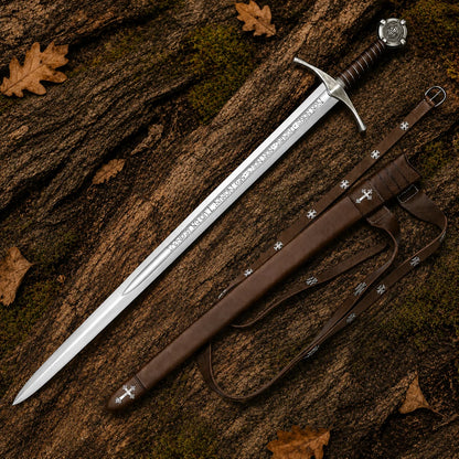 Accolade Knights Templar Sword Replica with brown leather-covered scabbard and shoulder straps displayed on forest bark