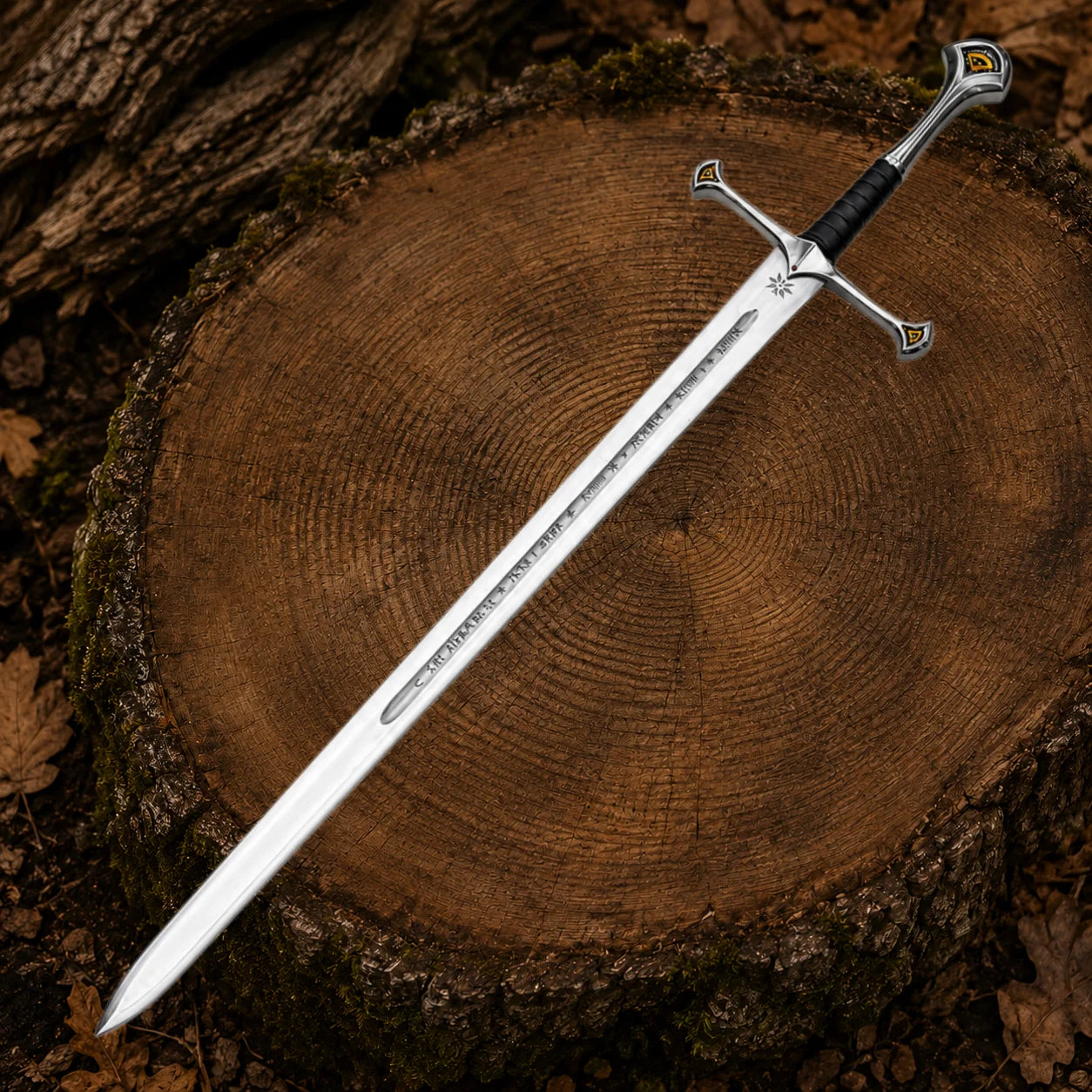 Full 45 inch Anduril display sword laid diagonally on a tree stump showing the engraved silver-coloured blade and black grip