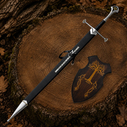 Sheathed Anduril sword beside a wooden Gondor-style plaque showing black scabbard straps and decorative metal fittings