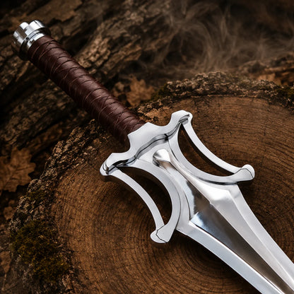 Close-up of the brown-wrapped handle and reflective sculpted guard on the He-Man Power Sword
