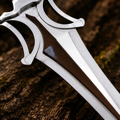 Angled detail of the polished Power Sword guard, brown centre panel and upper blade resting on textured bark