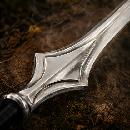 Detailed close-up of the polished stainless steel Power Sword hilt section with raised geometric centre panel