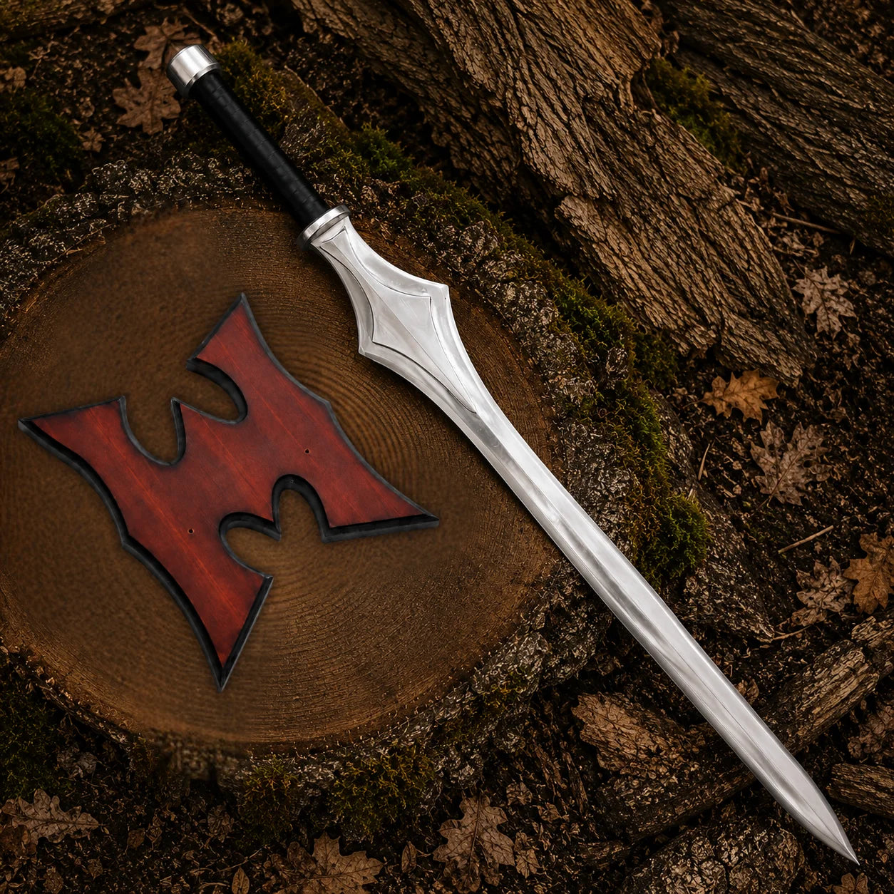 Full He-Man fantasy Power Sword and wall plaque arranged on woodland timber with moss and dry leaves