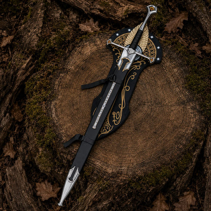 Sheathed Anduril sword laid over its ornate wall plaque on a moss-edged stump, highlighting black and silver fittings