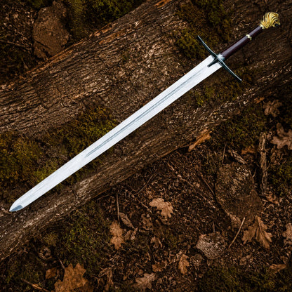 Full-length Peter Pevensie Rhindon Sword featuring an engraved silver blade, dark crossguard and gold lion-head pommel