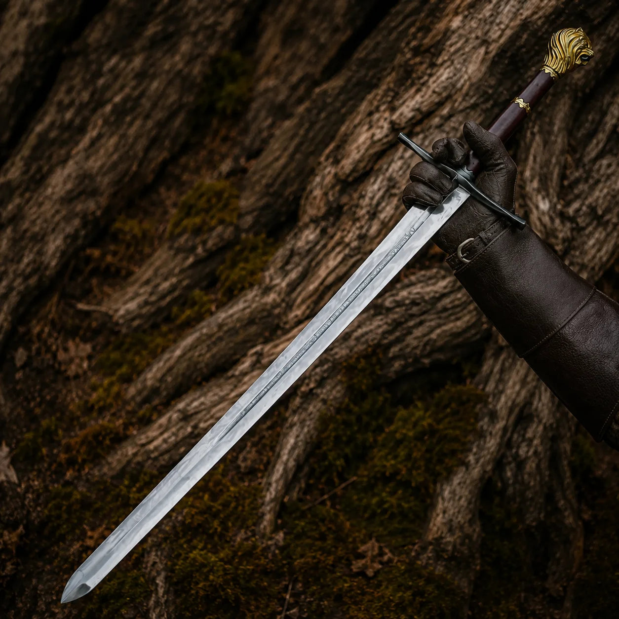 Black-gloved hand presenting the Peter Pevensie Rhindon Sword with silver engraved blade, dark handle and gold lion pommel