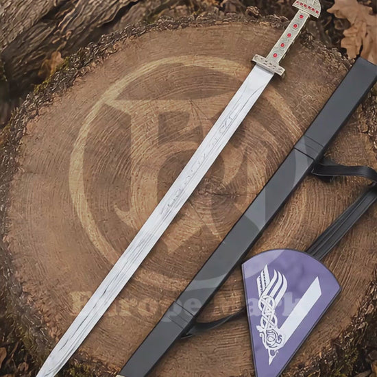 Product showcase video featuring the Ragnar Lothbrok Viking sword replica, engraved stainless steel blade, red jewel handle, black scabbard and Viking wall plaque