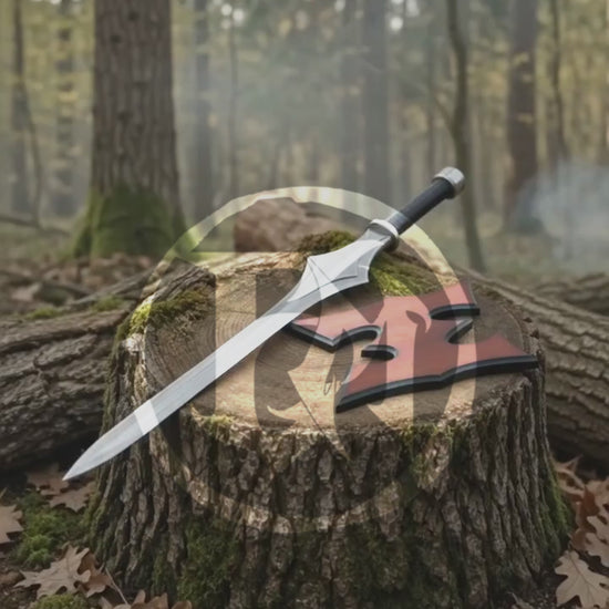 Vertical product video showing the silver He-Man Power Sword, black grip and collector display details in an atmospheric woodland setting.