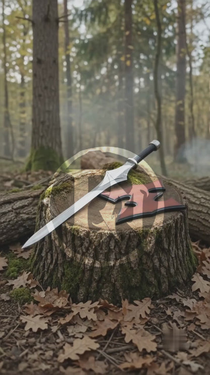 Vertical product video showing the silver He-Man Power Sword, black grip and collector display details in an atmospheric woodland setting.