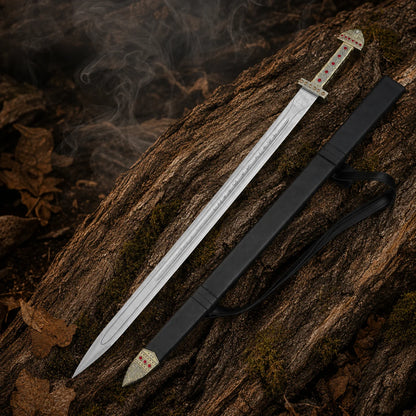 Ragnar Lothbrok Viking sword replica with black scabbard and strap arranged on moss-covered woodland bark