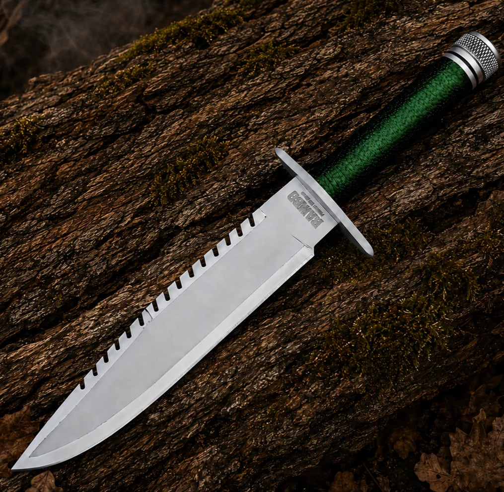 Full view of the Rambo First Blood Part I movie prop replica featuring a silver blade and dark green wrapped grip