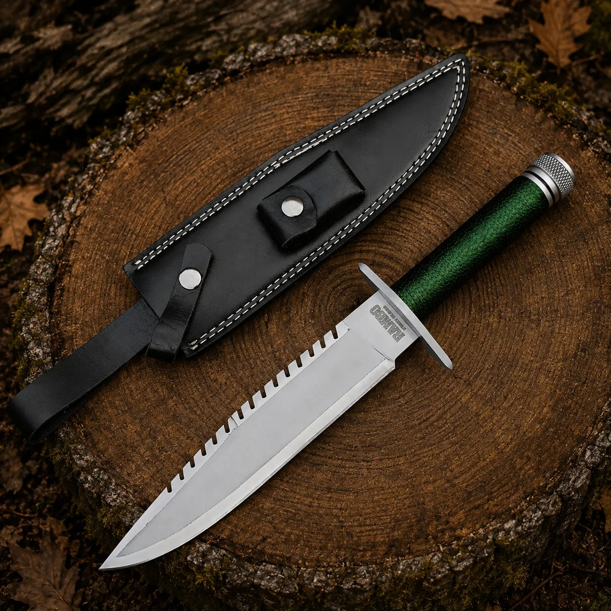 Rambo First Blood Part I Signature Edition replica and black leather sheath arranged on a natural woodland tree stump