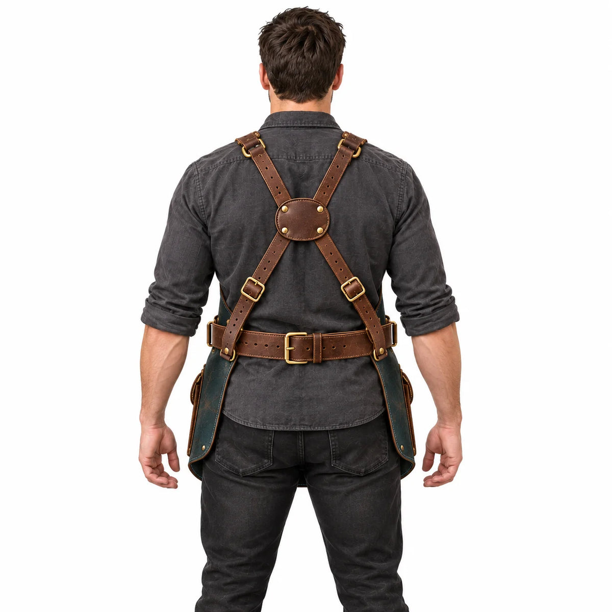 Back view of male model demonstrating the Studio Wing apron's brown leather cross-back harness, adjustable buckles and waist belt.