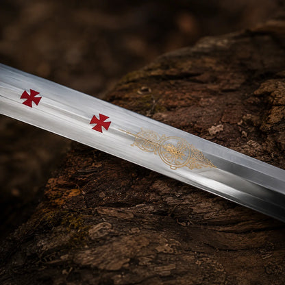 Close-up of the Templar Knights stainless steel blade showing red cross symbols and intricate gold engraved artwork